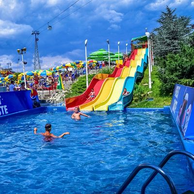 ODM Outdoor Large Water Amusement Park Summer Swimming Pool Fiberglass Rainbow Slide For Children